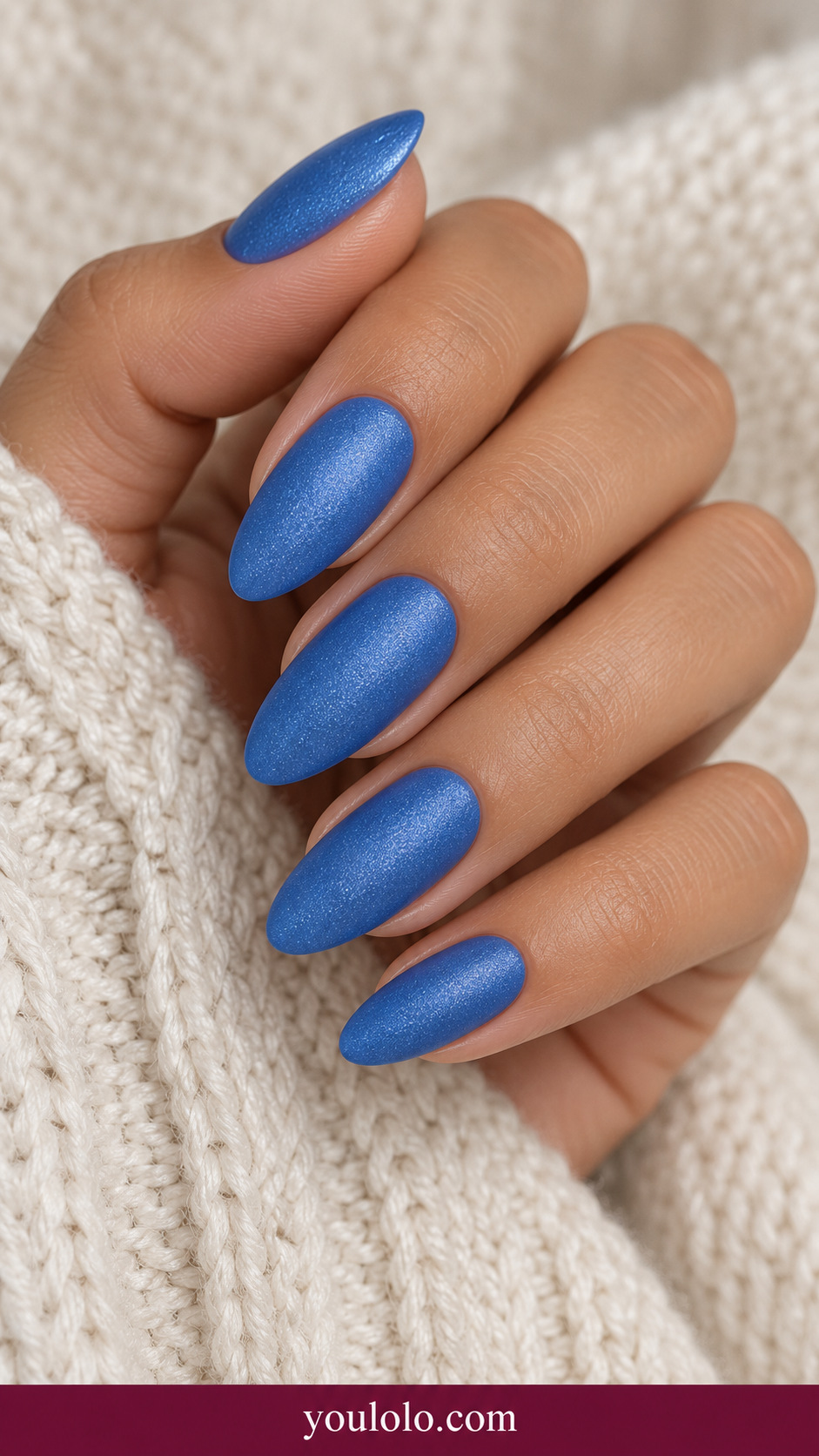 medium almond royal blue nails uniform extremely fine blue silver shimmer, no magnetic line and no decorations on a naturally relaxed adult hand