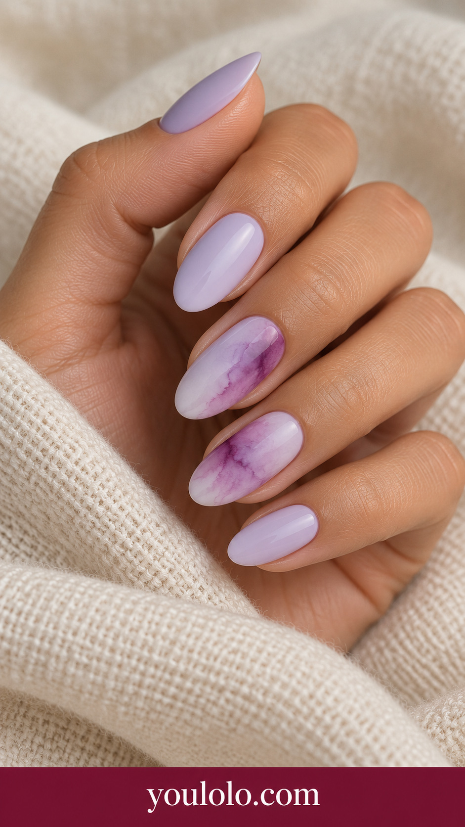 Plum Ink Wash: medium oval creamy lilac nails diffuse plum blooming diagonal watercolor wash on two accents on a naturally posed adult hand