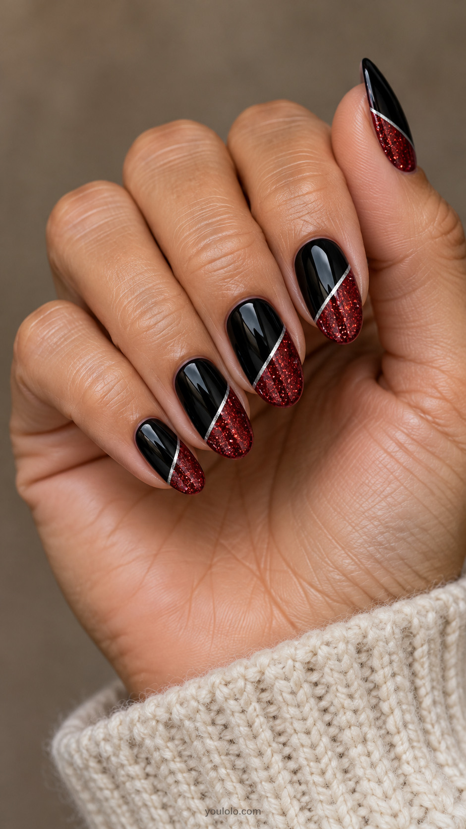 Black almond nails with diagonal red glitter blocks and thin silver lines