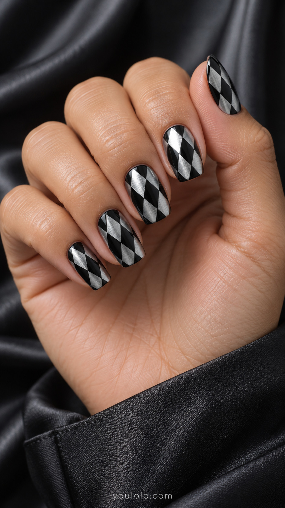 Medium square nails black and brushed silver elongated diamonds in offset harlequin arrangement, elegant flat graphic no glitter