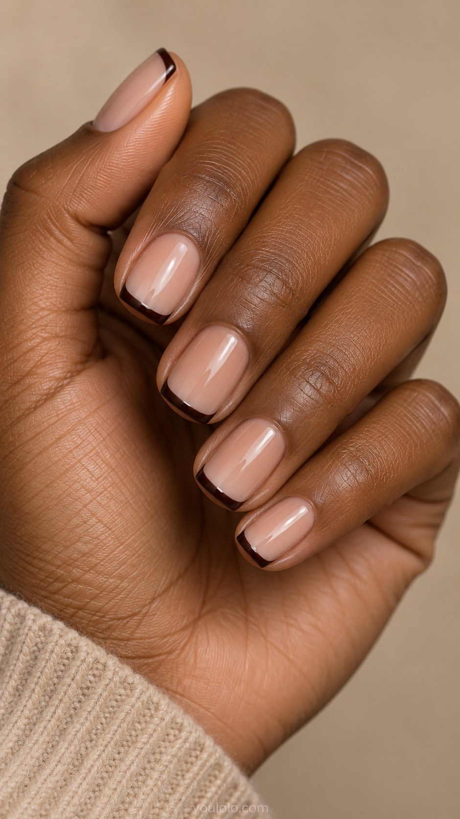 Short square nails with caramel nude bases and narrow dark chocolate French tips.