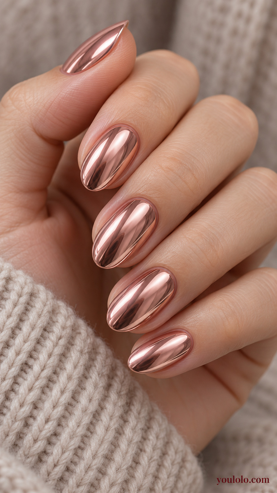Rose-Gold Almond Chrome on a naturally gathered feminine hand showing the nail finish