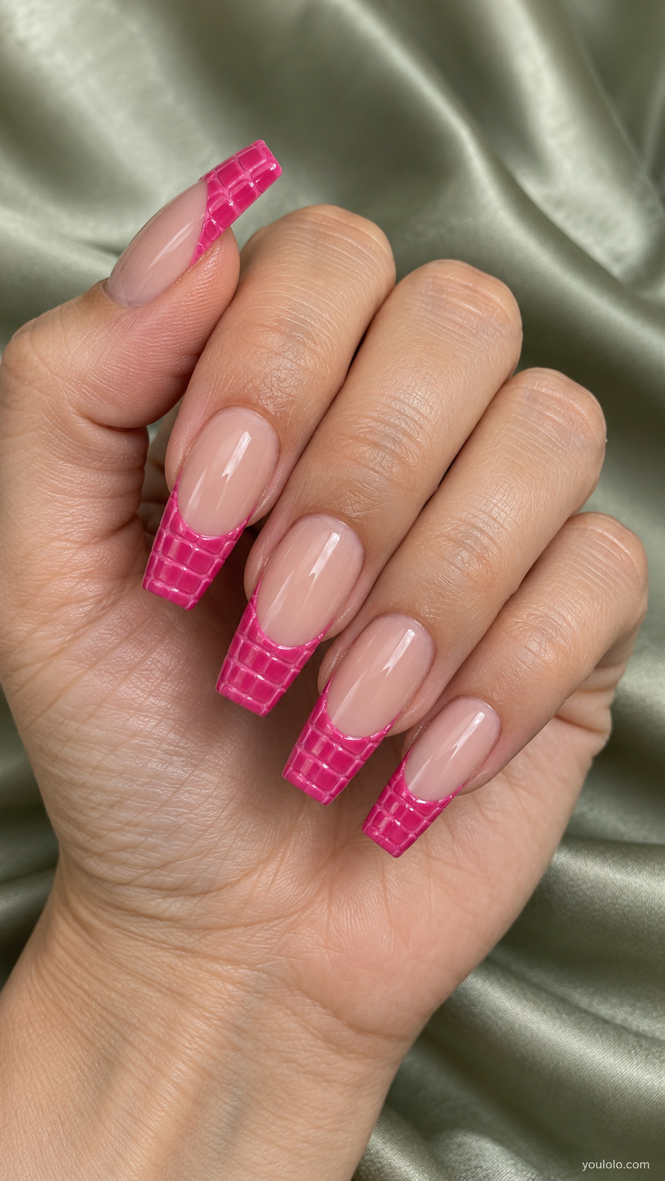 Long nude coffin nails with textured hot pink crocodile-pattern French tips