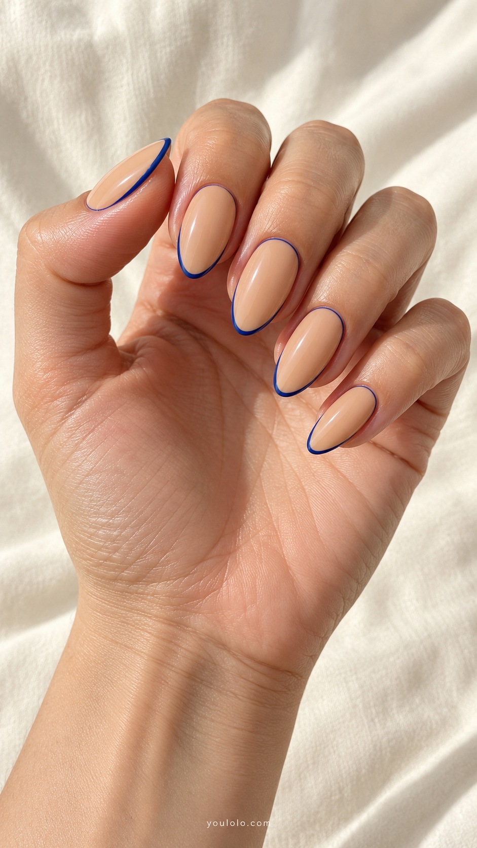 Caramel Blue Outline — medium almond caramel cream nails fine cobalt blue perimeter outline