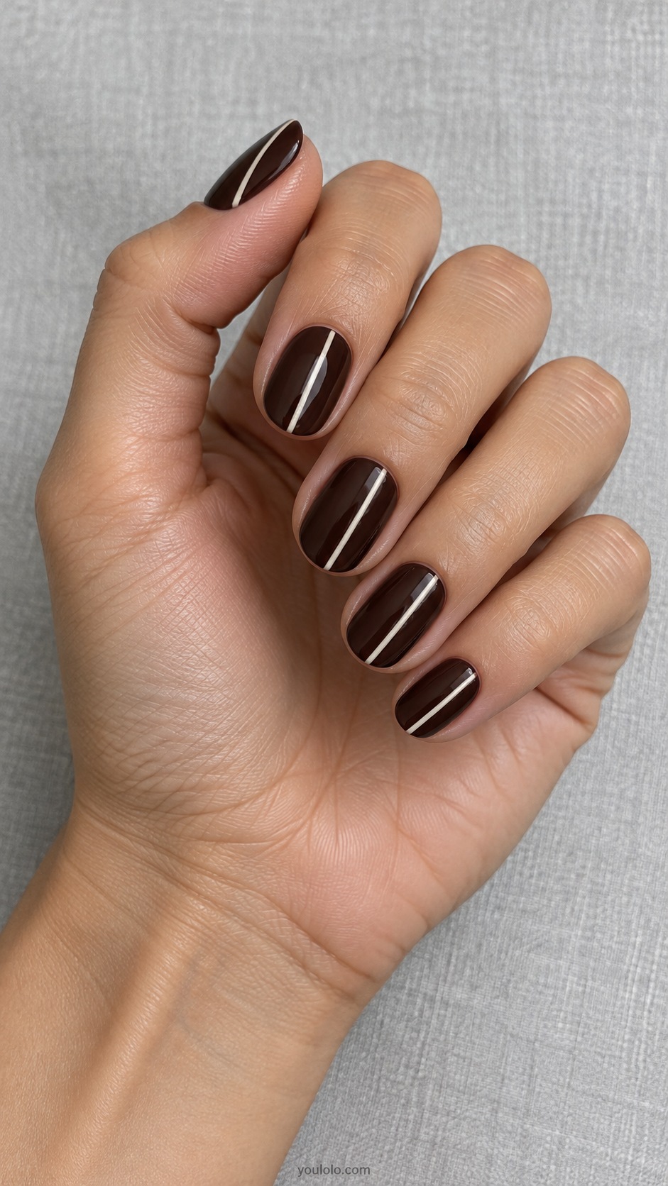 Espresso Fine Ivory Stripe — short oval espresso nails one fine ivory vertical line offset on each nail