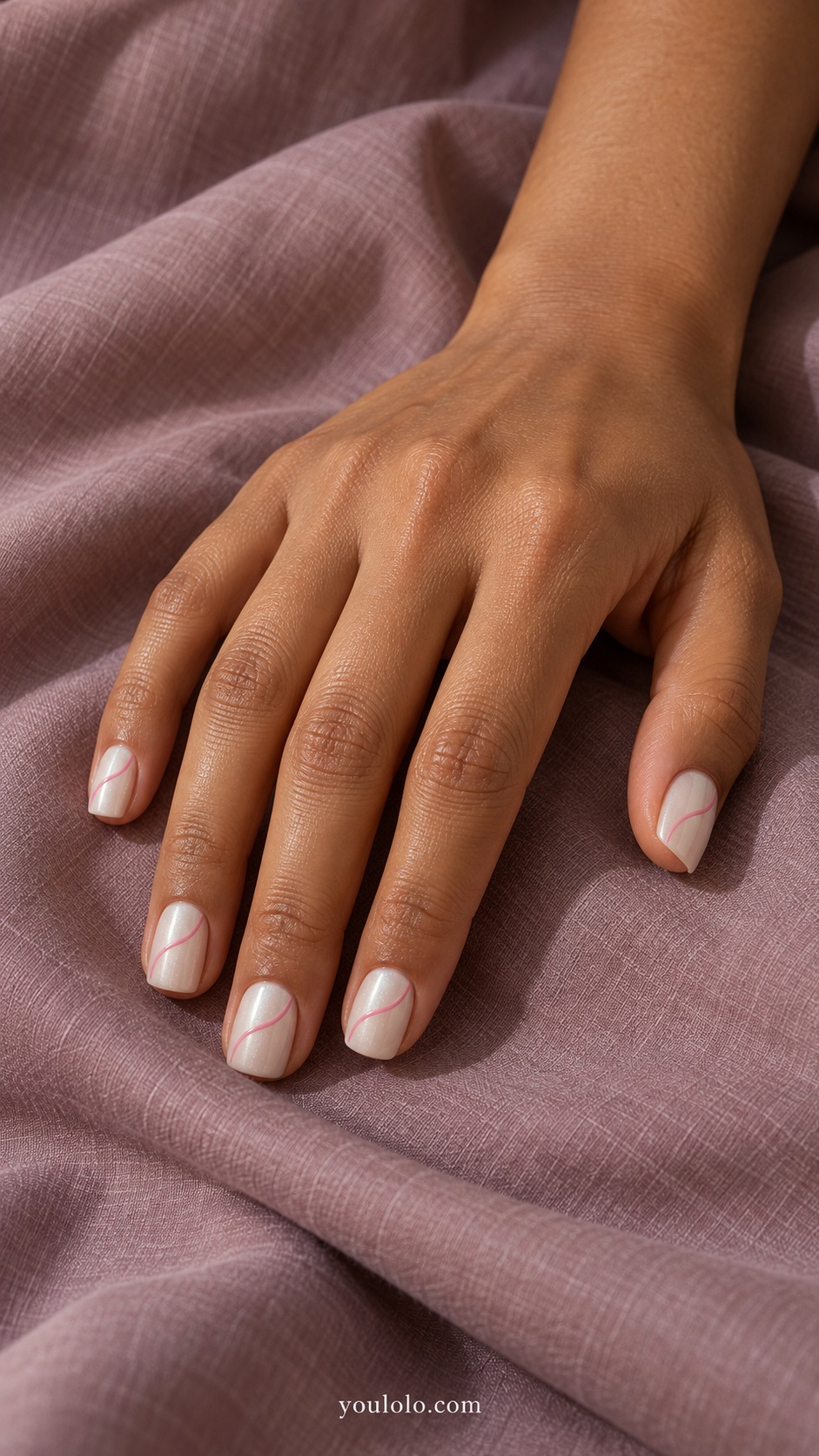 Short square ivory pearl nails one fine curved rose pink painted ribbon across each nail