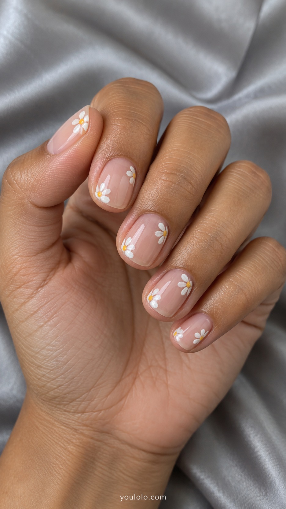 Short Artsy Nails: Negative-Space Daisies manicure on a naturally posed hand