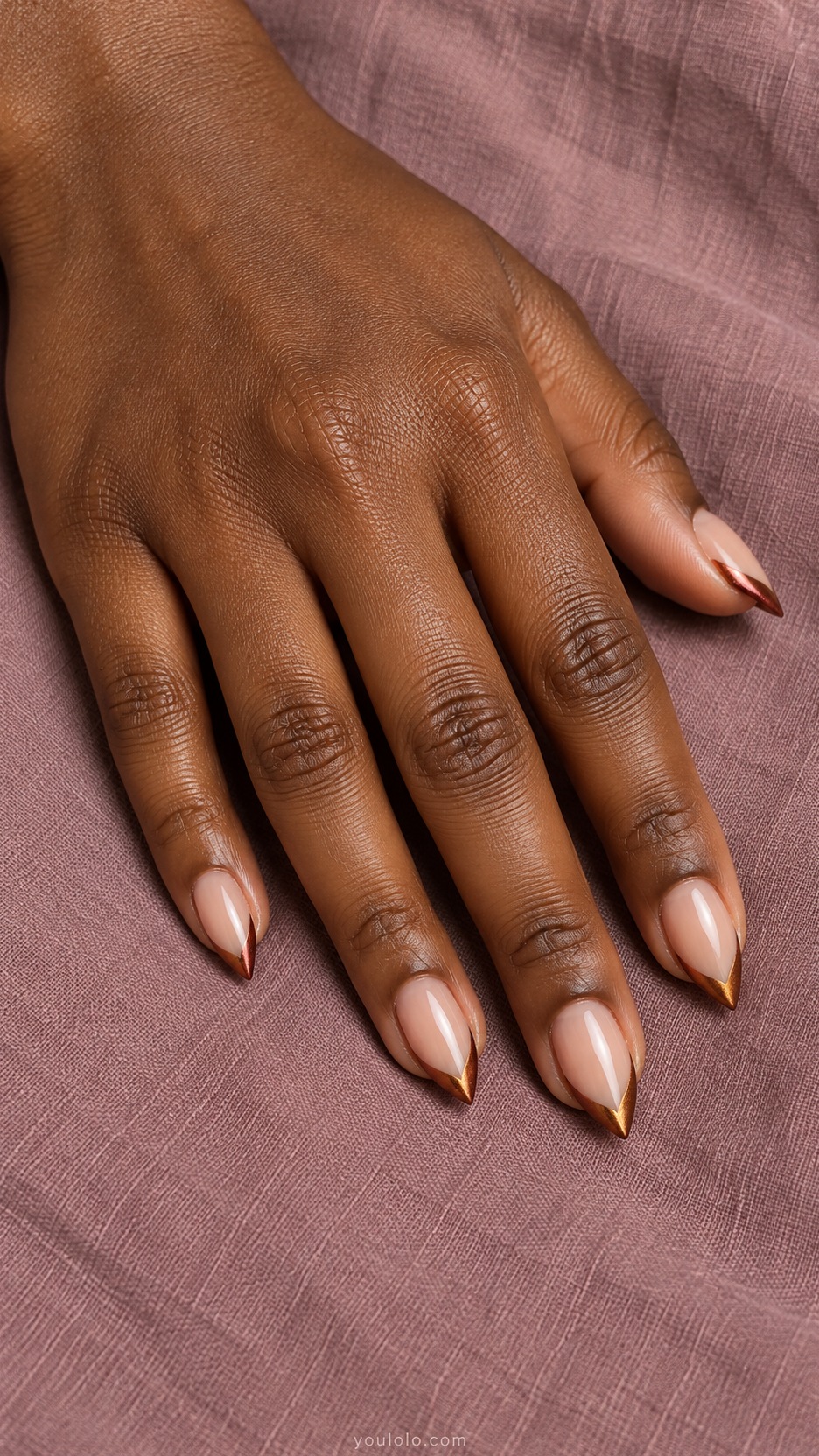 Short Stiletto French Nails: Copper Side Contour manicure on a naturally posed hand