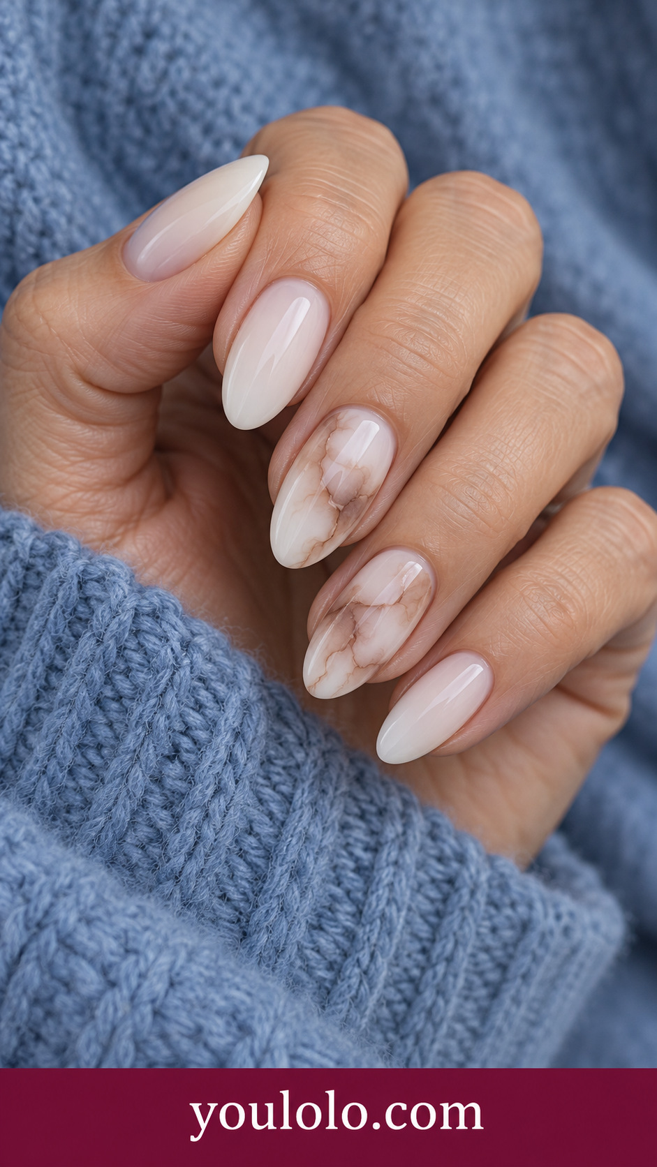Coffee Milk Marble: medium almond milky ivory nails two accents pale coffee blooming swirls with translucent milk gaps on a naturally posed adult hand
