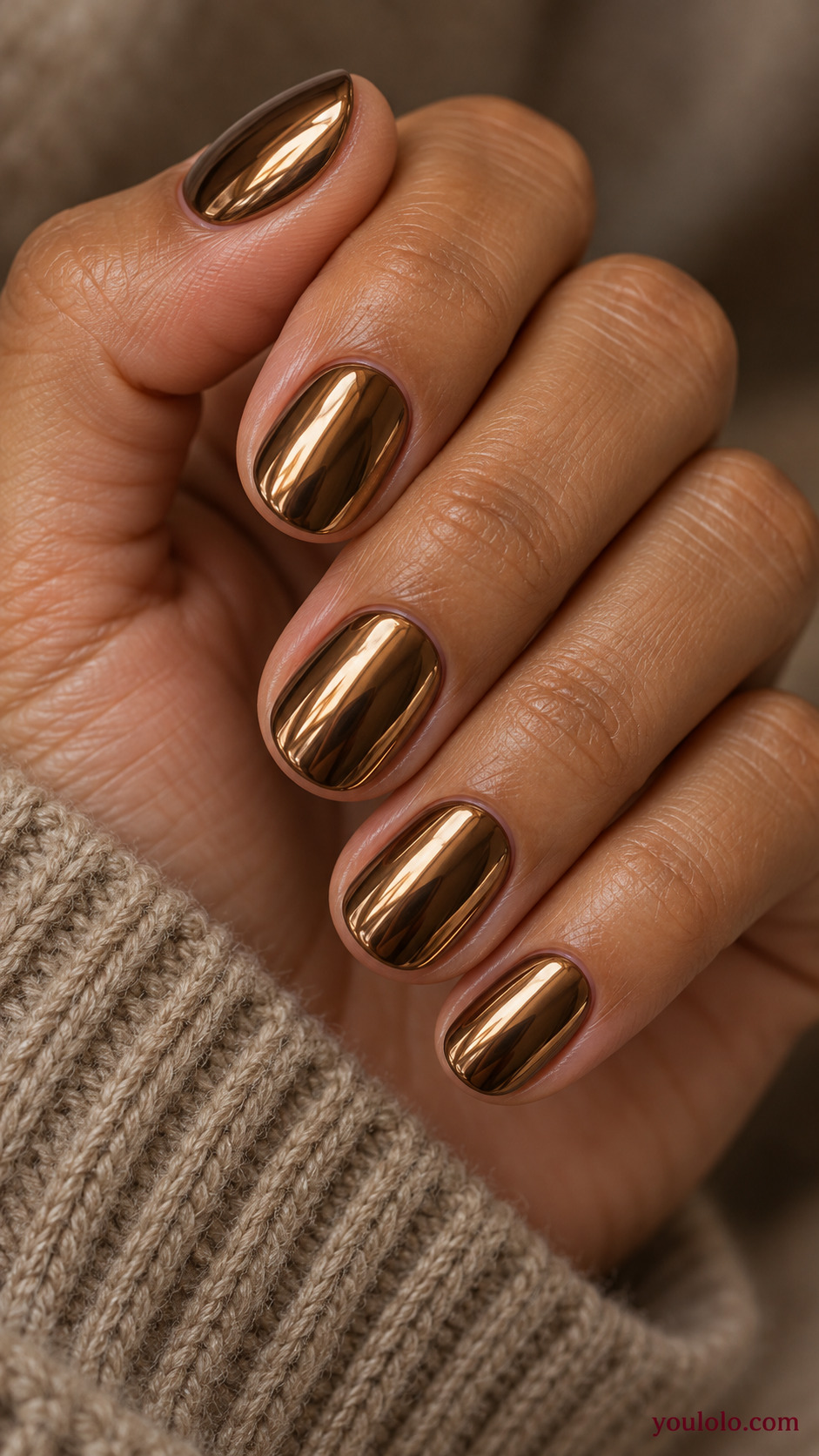 Bronze Mirror on Rounded Nails on a naturally gathered feminine hand showing the nail finish