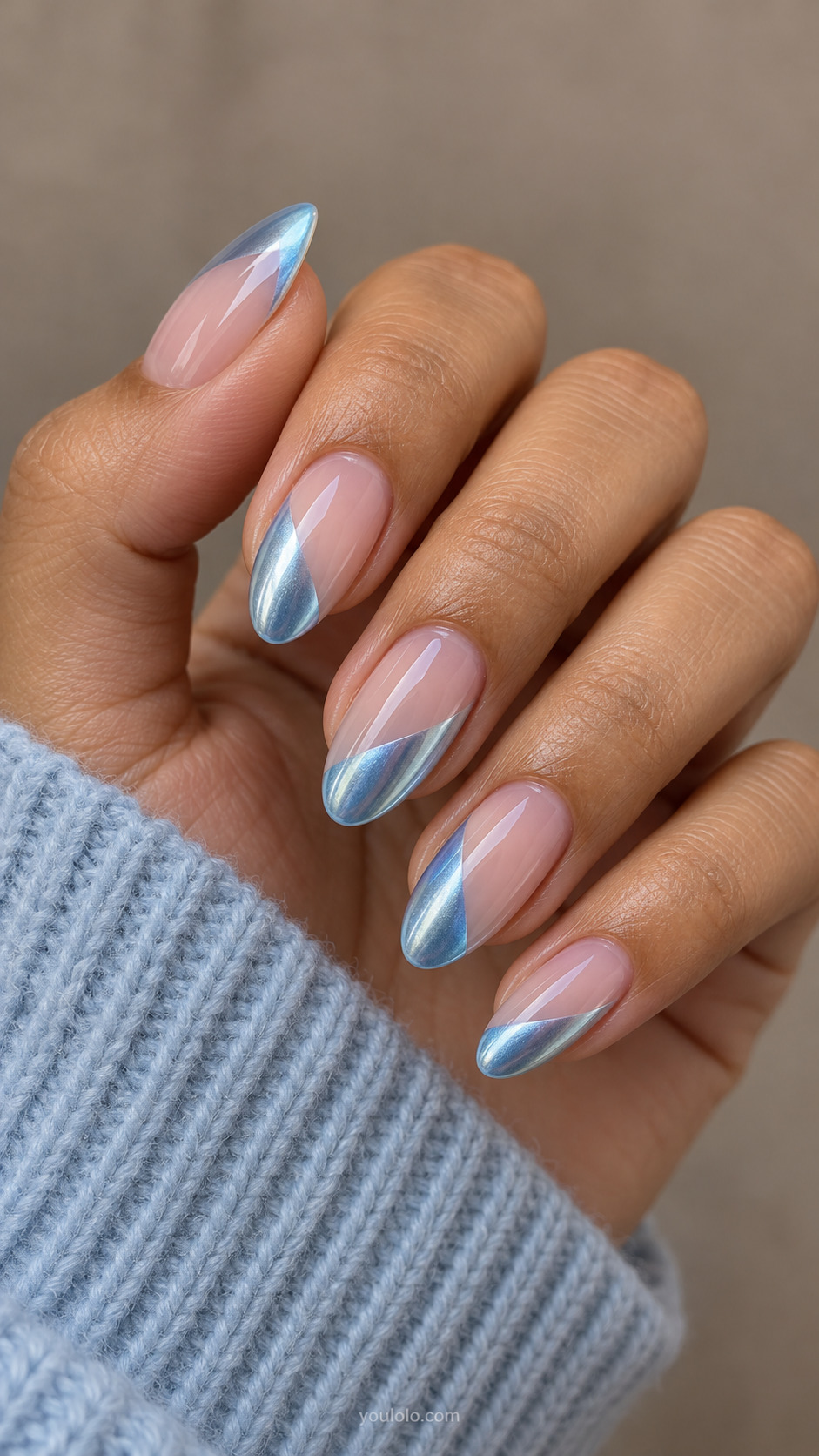 Sheer pink almond nails with diagonal glacier-blue chrome panels at the tips.