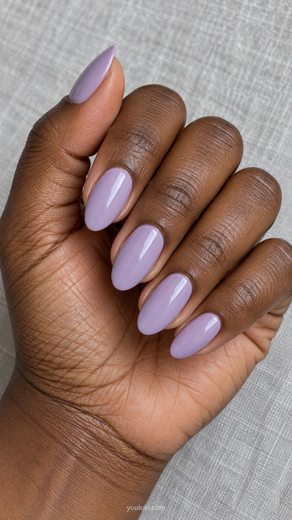 Medium almond nails pale desaturated wisteria purple cream gloss