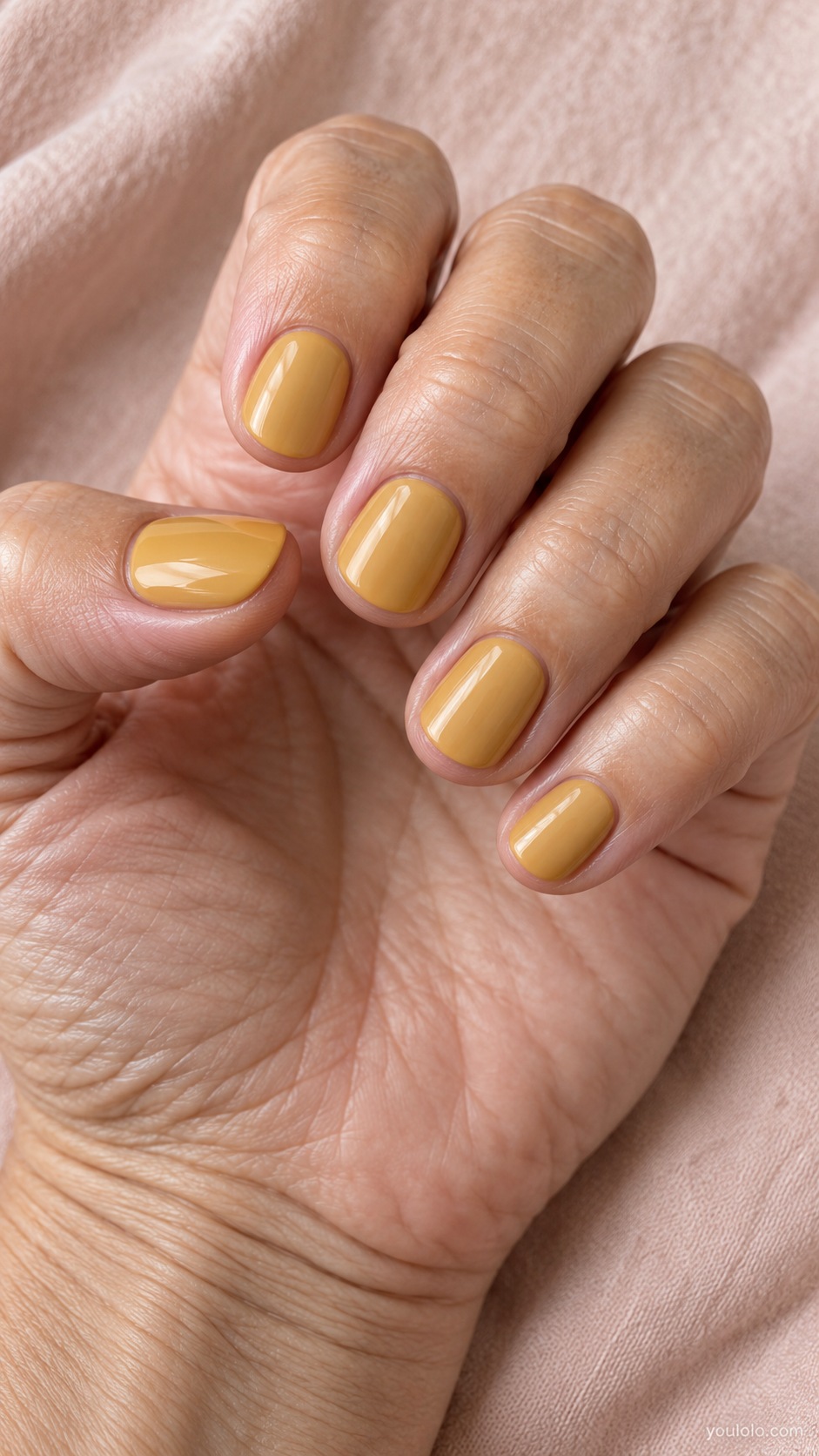 Short round nails muted subdued golden ochre yellow cream gloss