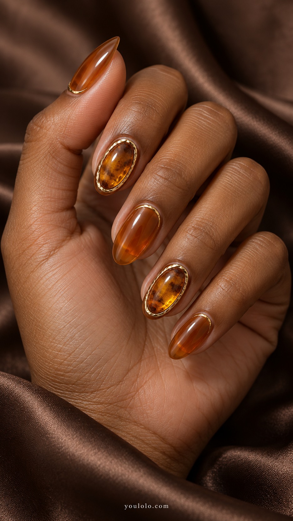 Amber Cabochon Frames — Medium oval nails, translucent warm amber, two accent nails have smooth domed honey amber cabochon oval centers surrounded by fine antiqued gold low rim, remaining nails translucent amber with tiny gold crescent, no real jewelry