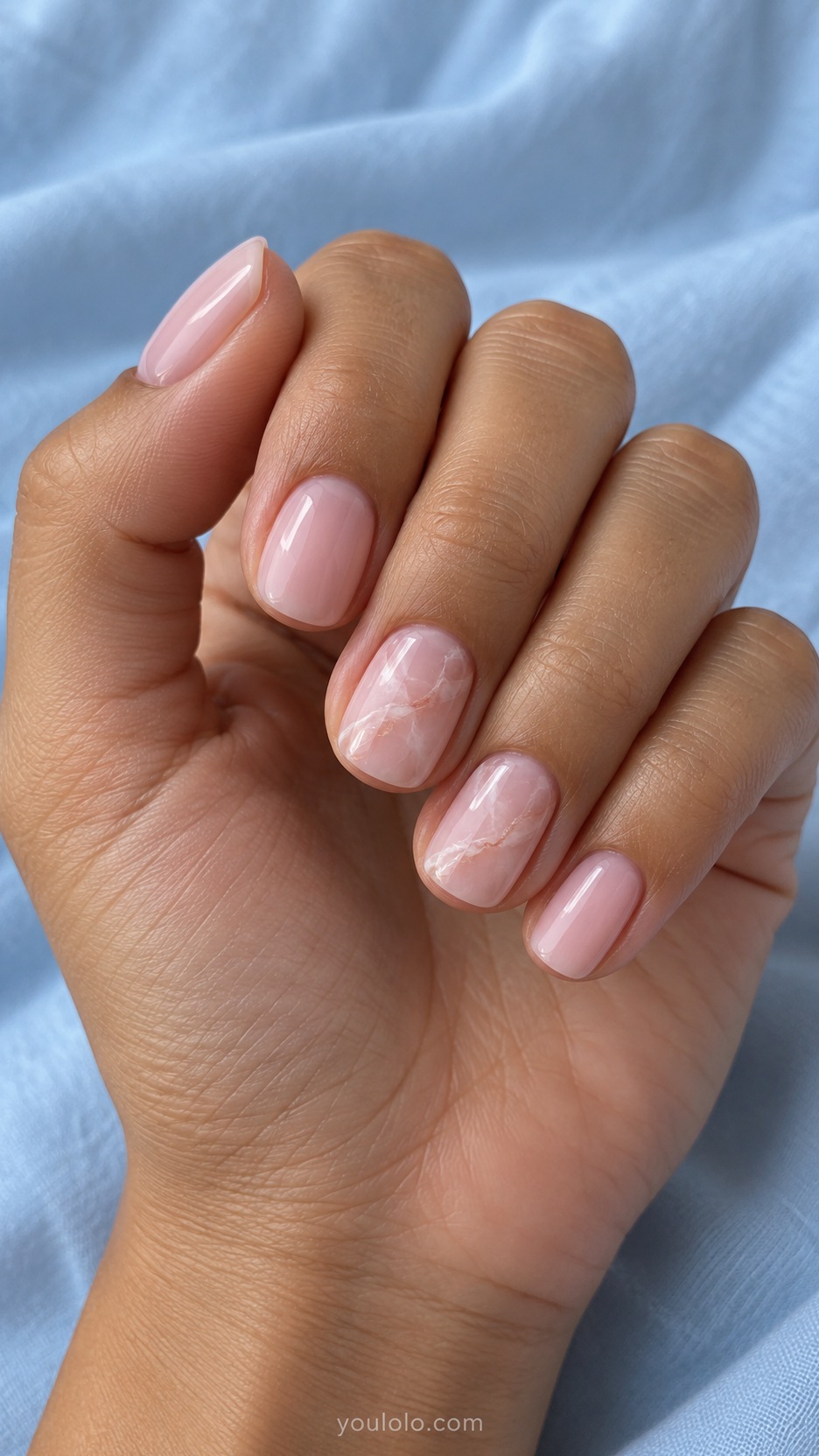 Short Wedding Nails: Rose Quartz Whisper manicure on a naturally posed hand