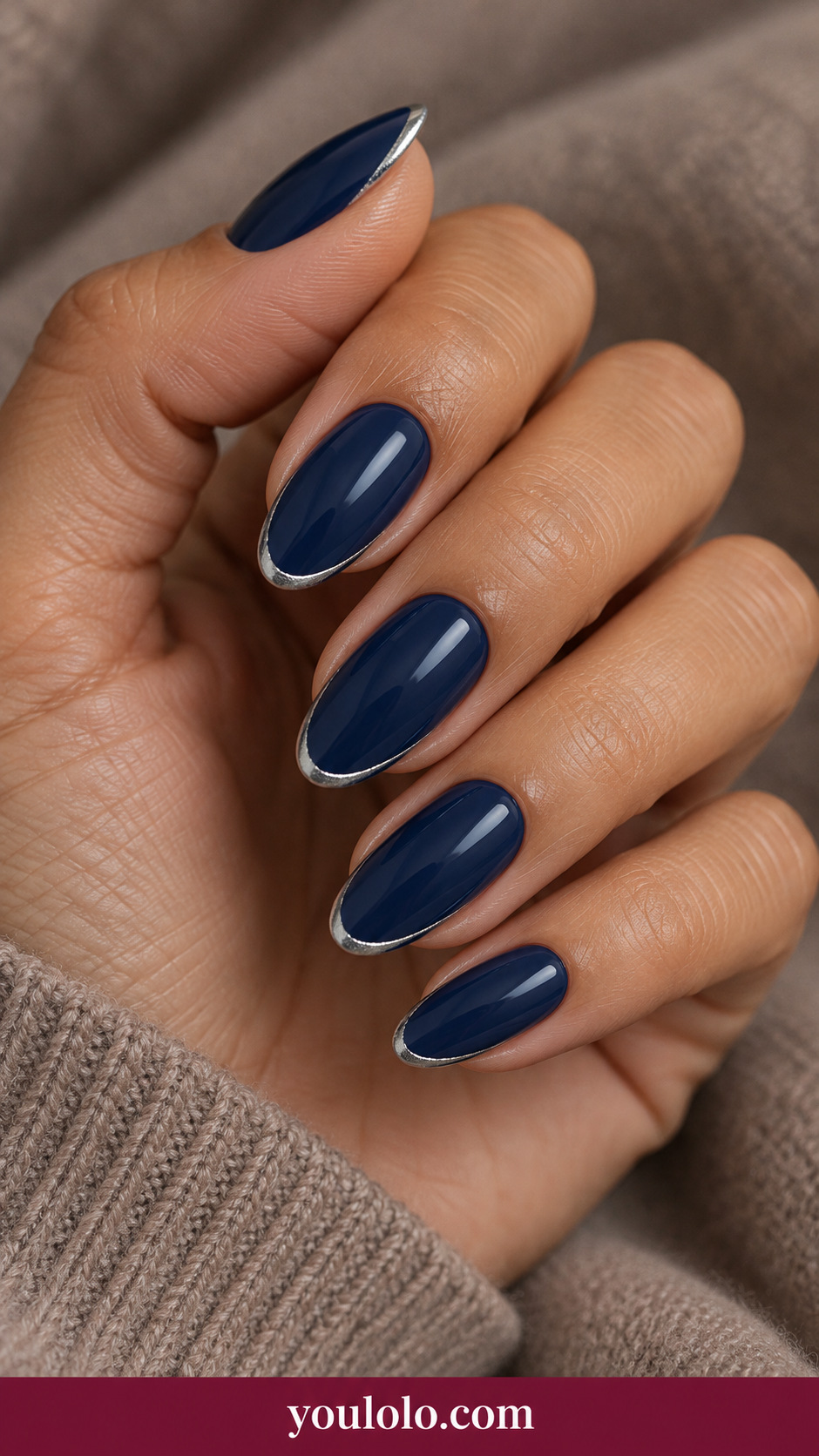 medium oval glossy midnight navy nails thin silver crescent following tip edge on every nail, no stars on a naturally relaxed adult hand