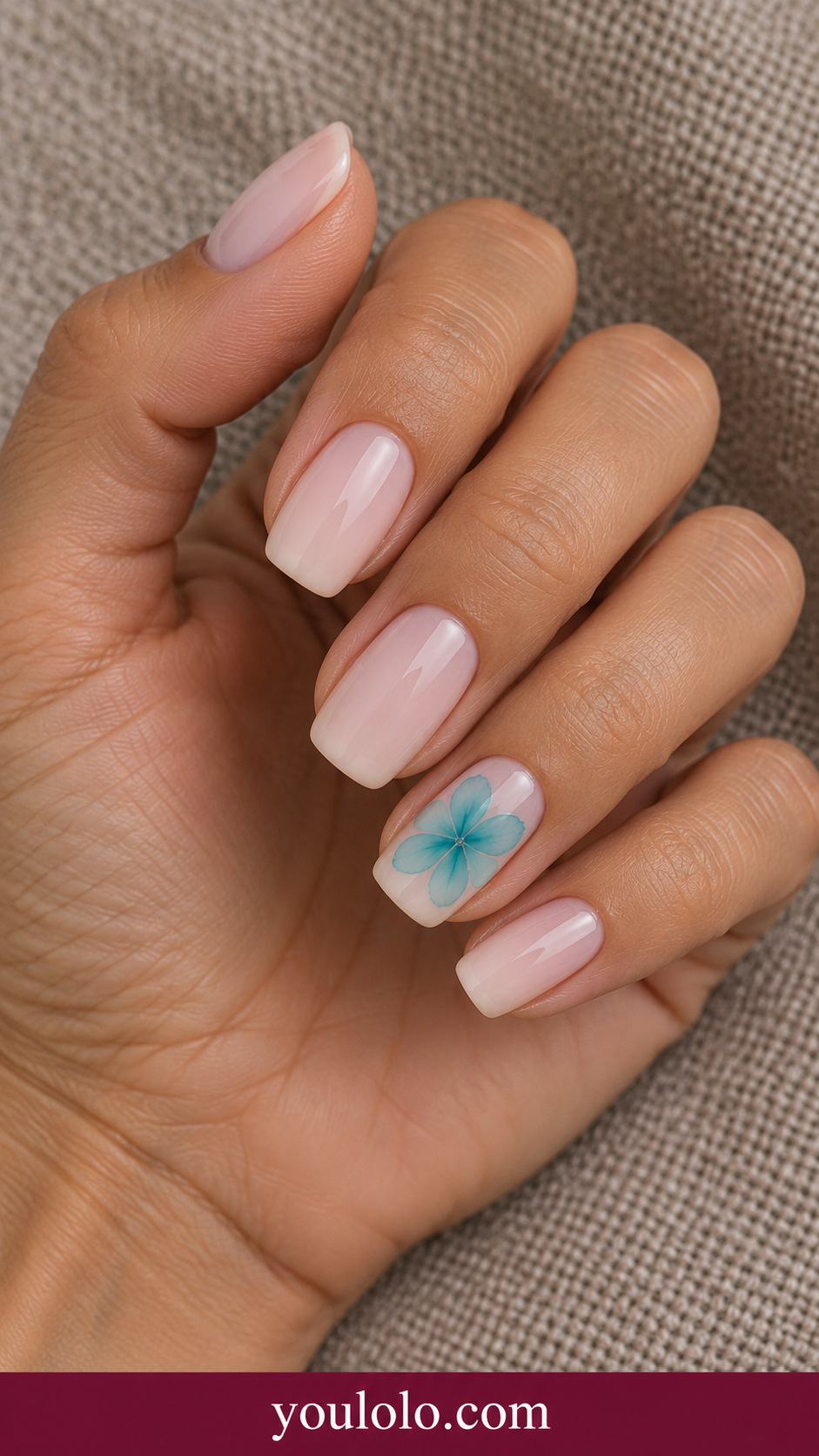 Turquoise Petal Pool: medium squoval pale nude nails ring nail soft turquoise blooming five petal flower with clear center on a naturally posed adult hand