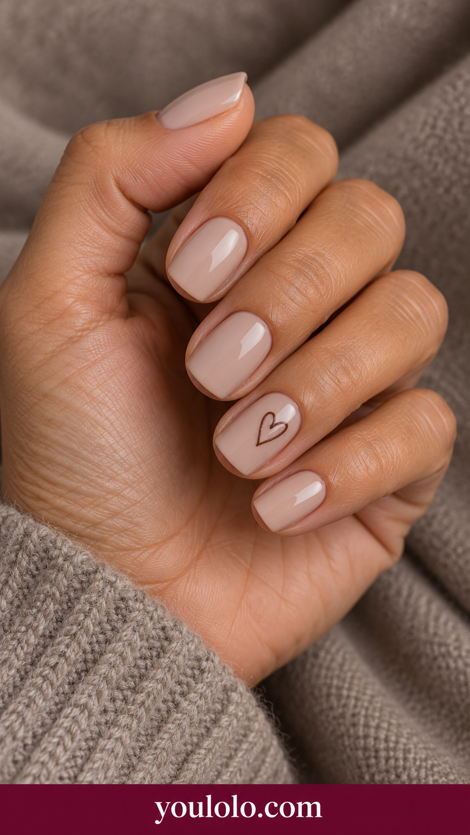 Chocolate Heart Outline: short square warm beige nails one fine chocolate brown open heart tilted on ring nail on a naturally posed adult hand