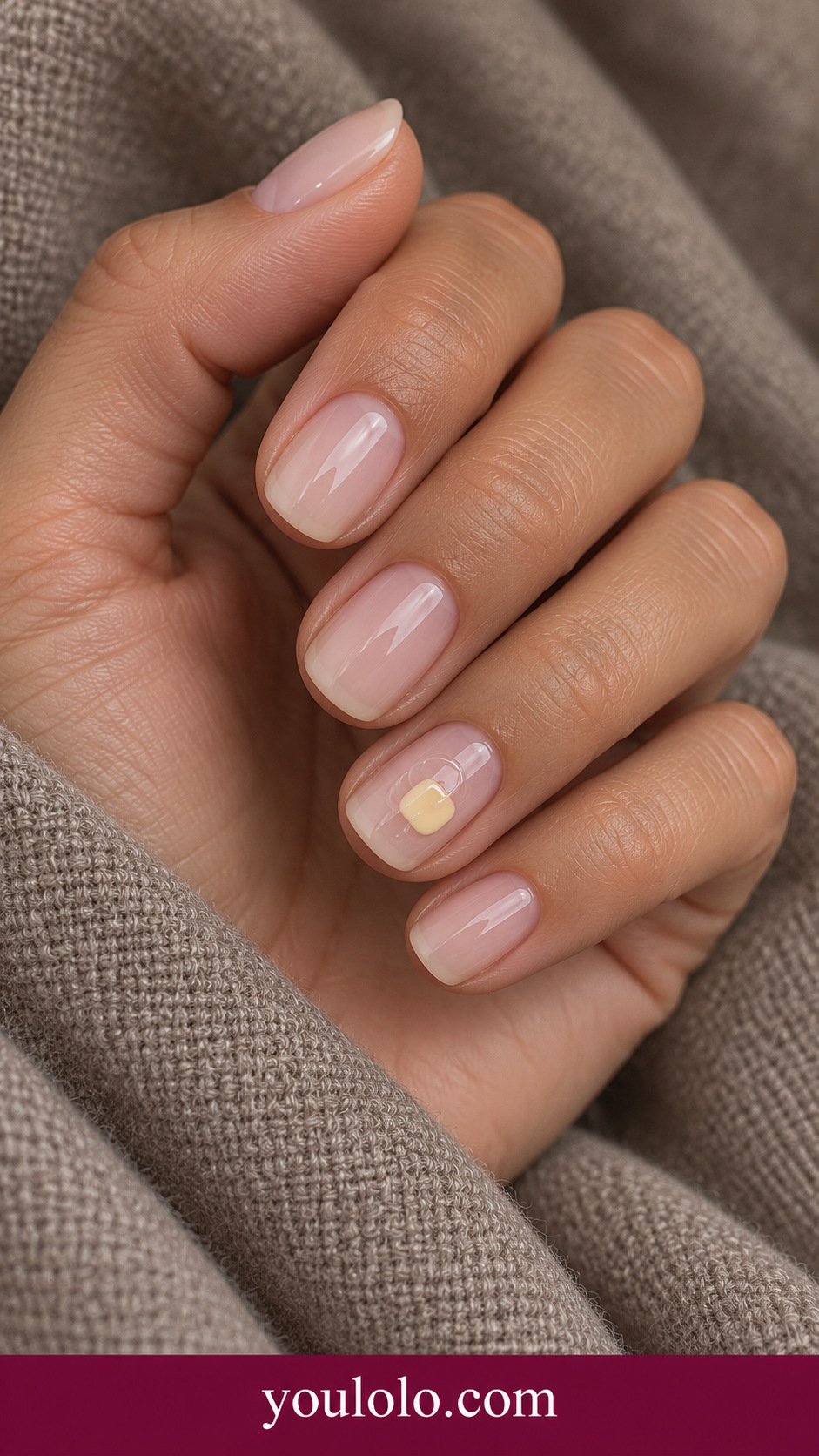 Butter Cream Tiny Seal: short squoval translucent nude nails ring nail small pale butter yellow rounded square gel seal low profile on a naturally posed adult hand