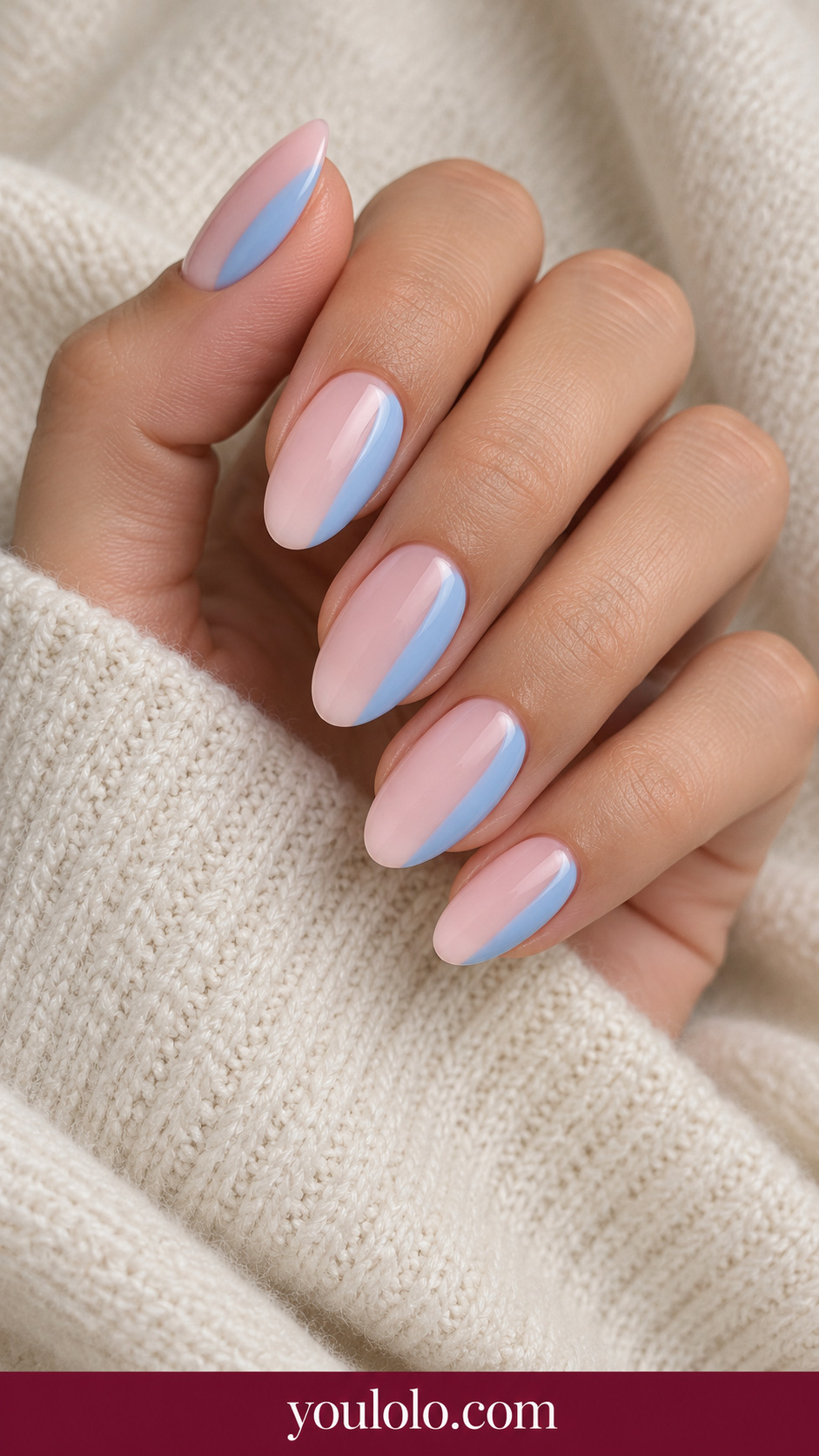 Pink Blue Half Dip: medium oval pale pink nails clean sky blue rounded side panels covering one quarter of nail on a naturally posed adult hand