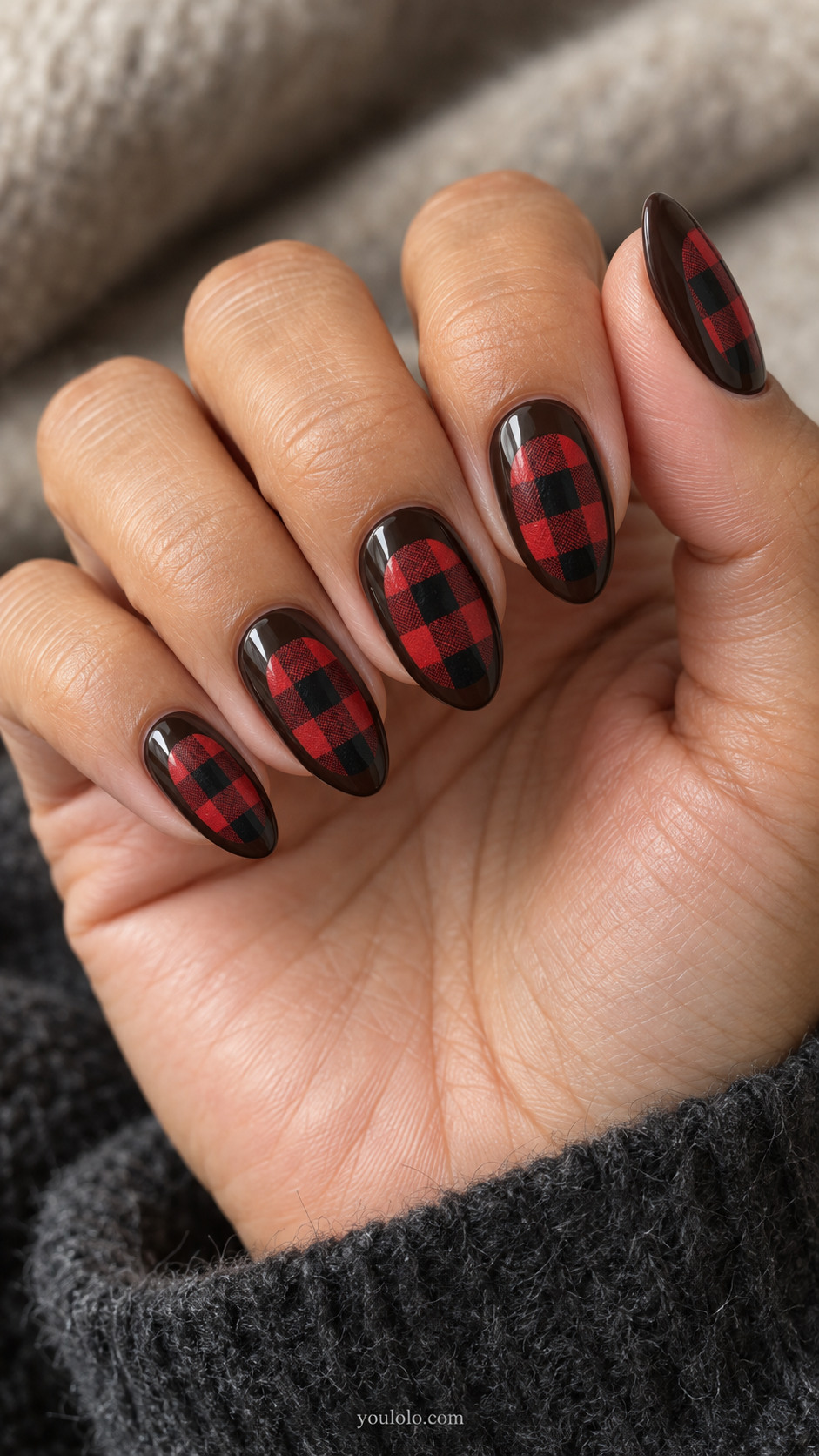 Espresso almond nails with red-and-black checked oval insets