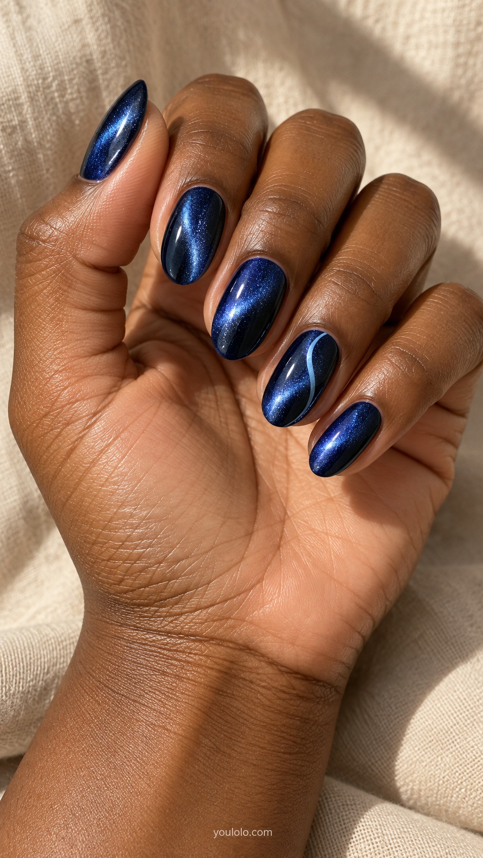 Midnight Blue with One Fine Wave cat eye nails — Medium oval midnight blue magnetic nails with one fine pale blue S curve on ring nail.
