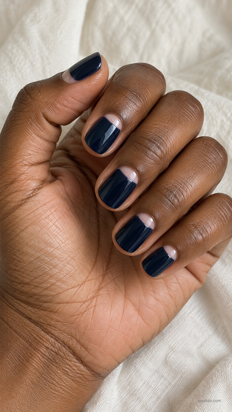 Short squoval nails very dark ink blue with small bare neutral pink cuticle half moons
