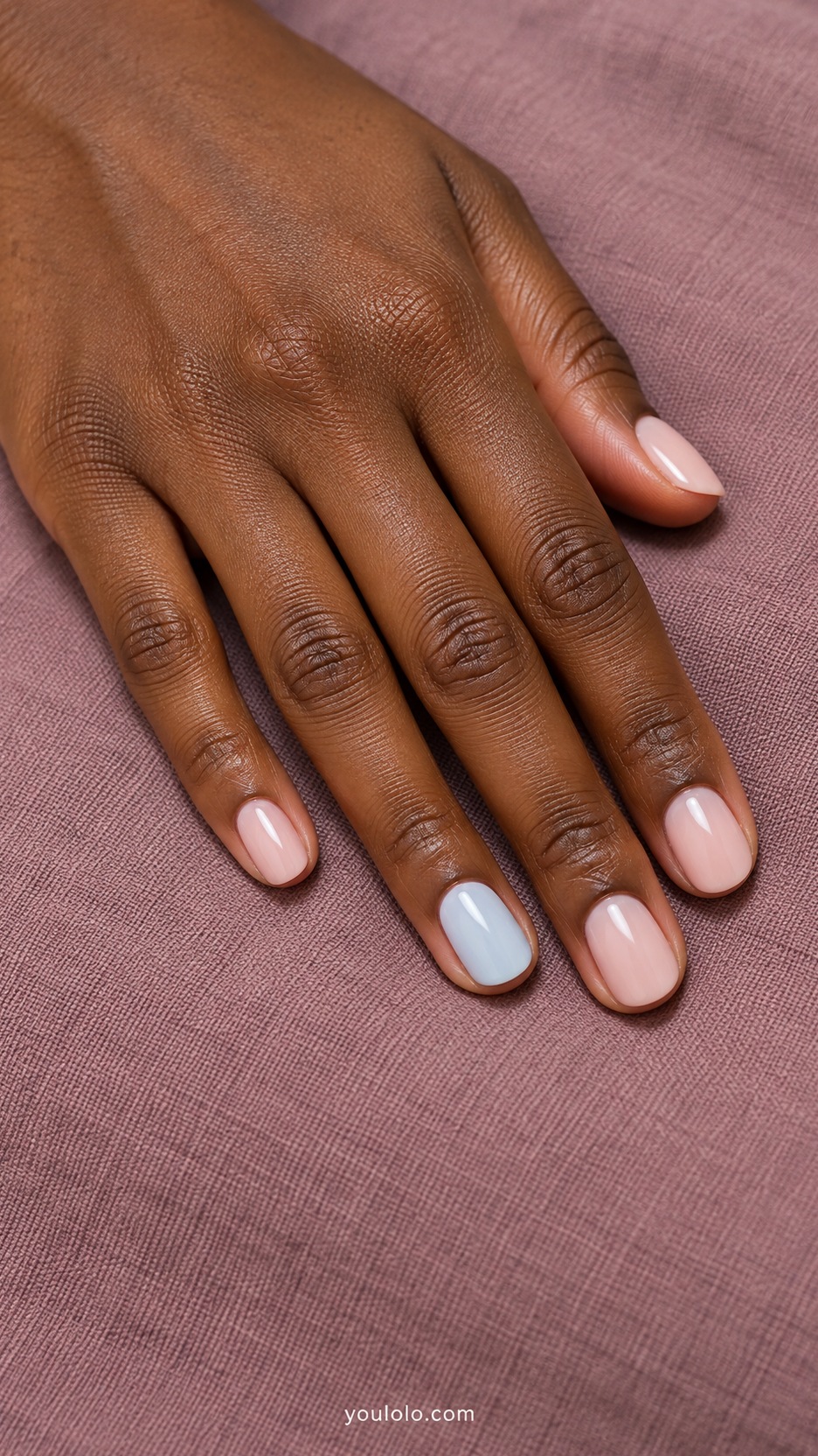 Short Wedding Nails: Baby Blue Accent manicure on a naturally posed hand