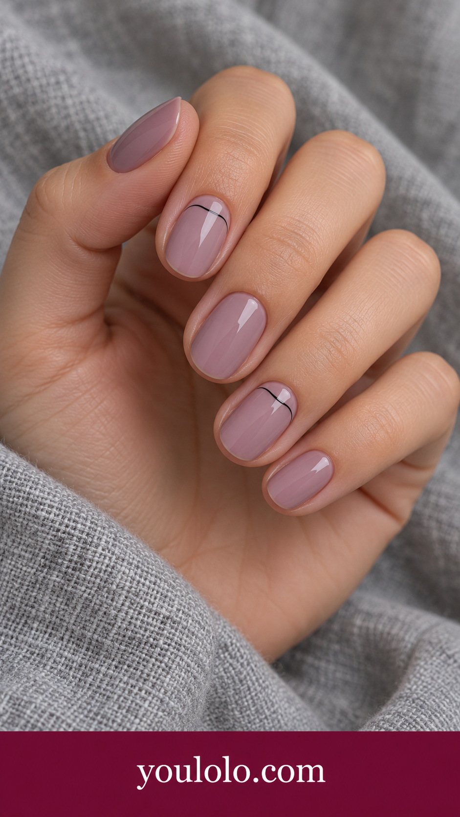 Mauve Cuticle Arc: short oval muted mauve nails very thin black curved line just above base of two accents on a naturally posed adult hand