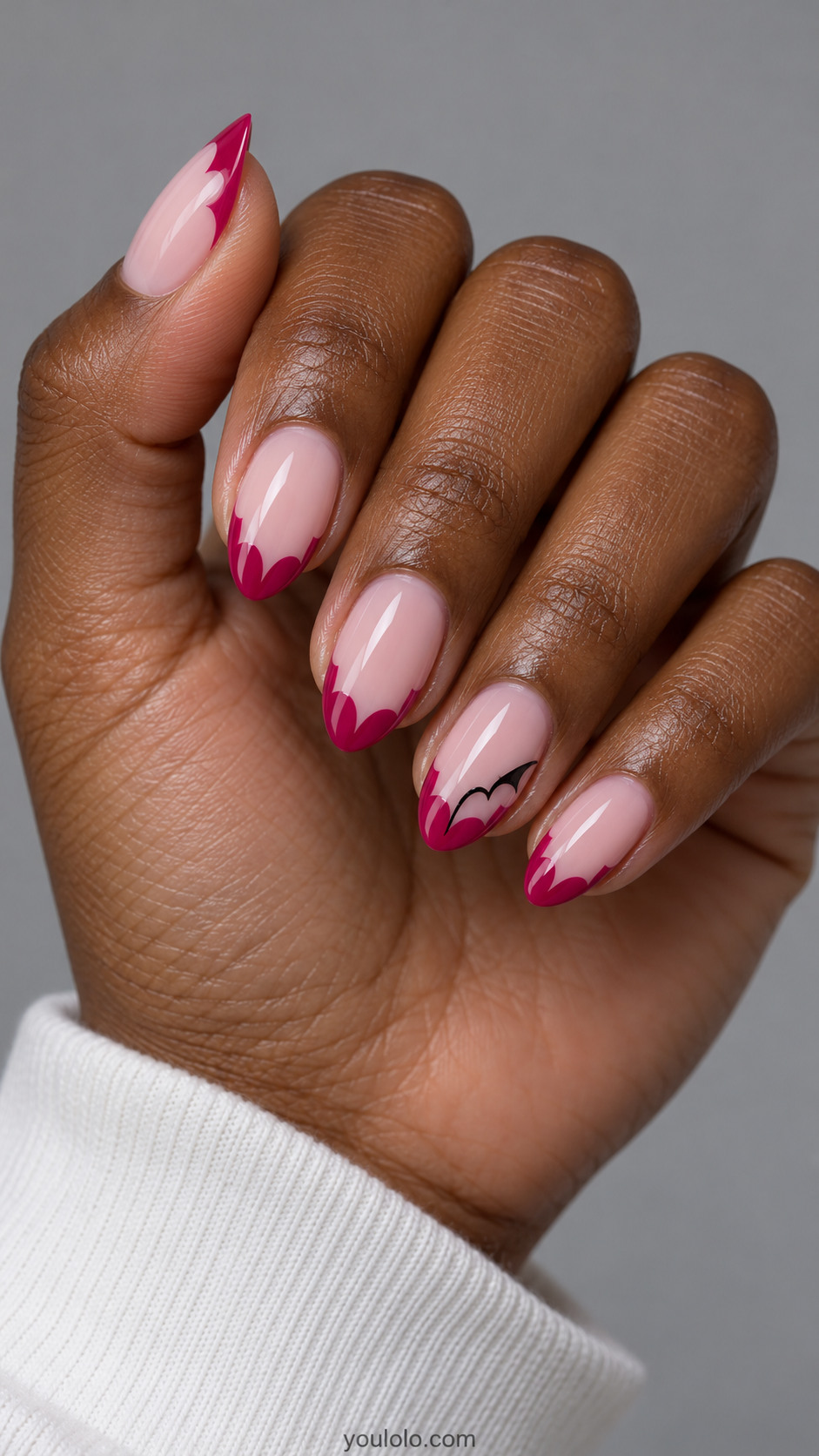 Pink almond nails with fuchsia bat-wing shaped side tips