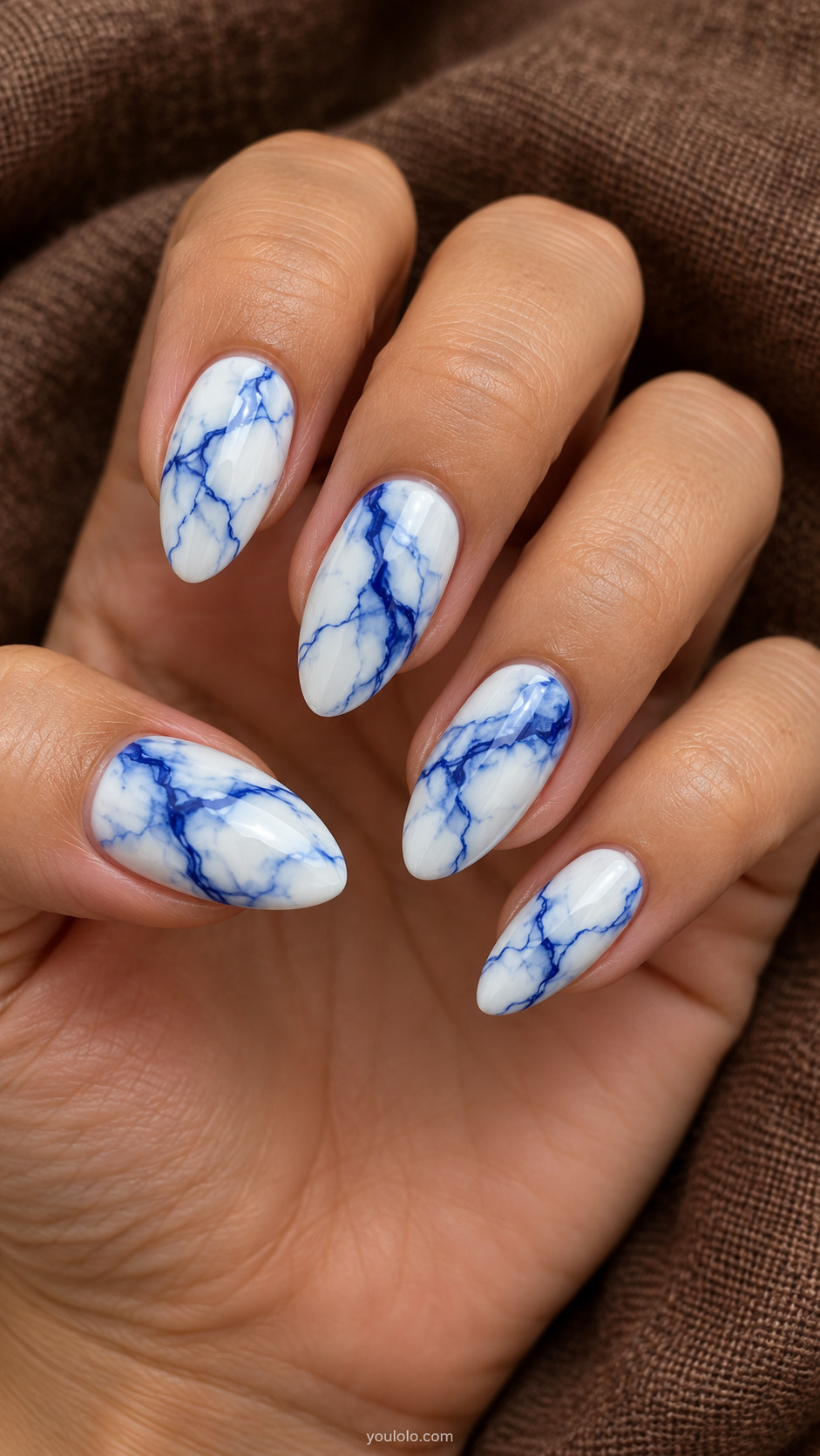White almond nails with royal blue marble veining