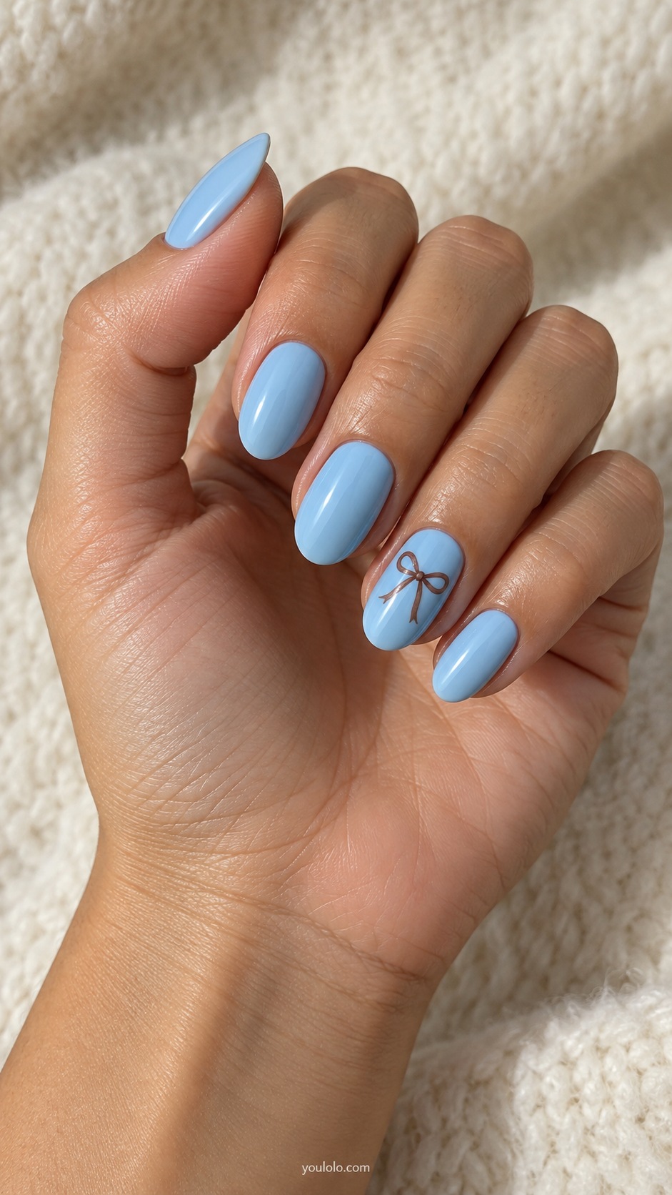 Baby Blue Cocoa Bow — medium oval baby blue nails one tiny hand painted cocoa ribbon bow on ring nail