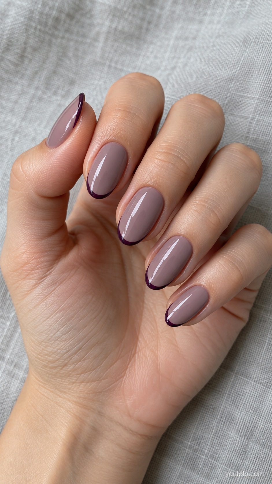 Medium oval nails purple taupe cream base with hairline dark plum French tip