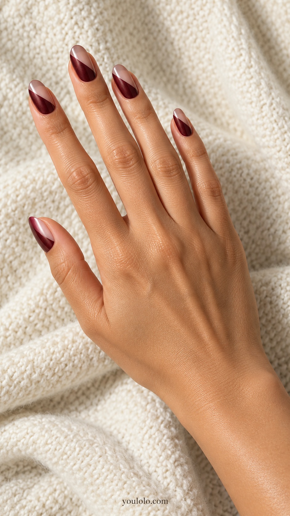 Medium oval nails diagonal split translucent rose beige glaze and opaque burgundy pearl, crisp seam