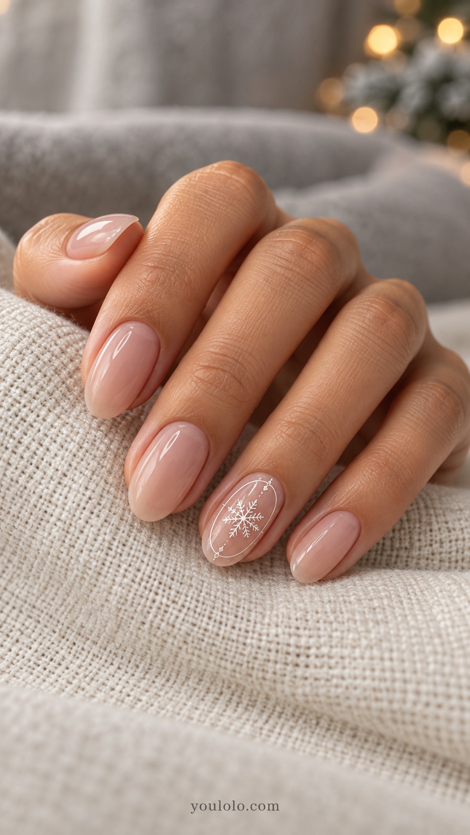 Medium oval sheer nude nails thin white frame on ring nail with small white snowflake inside frame