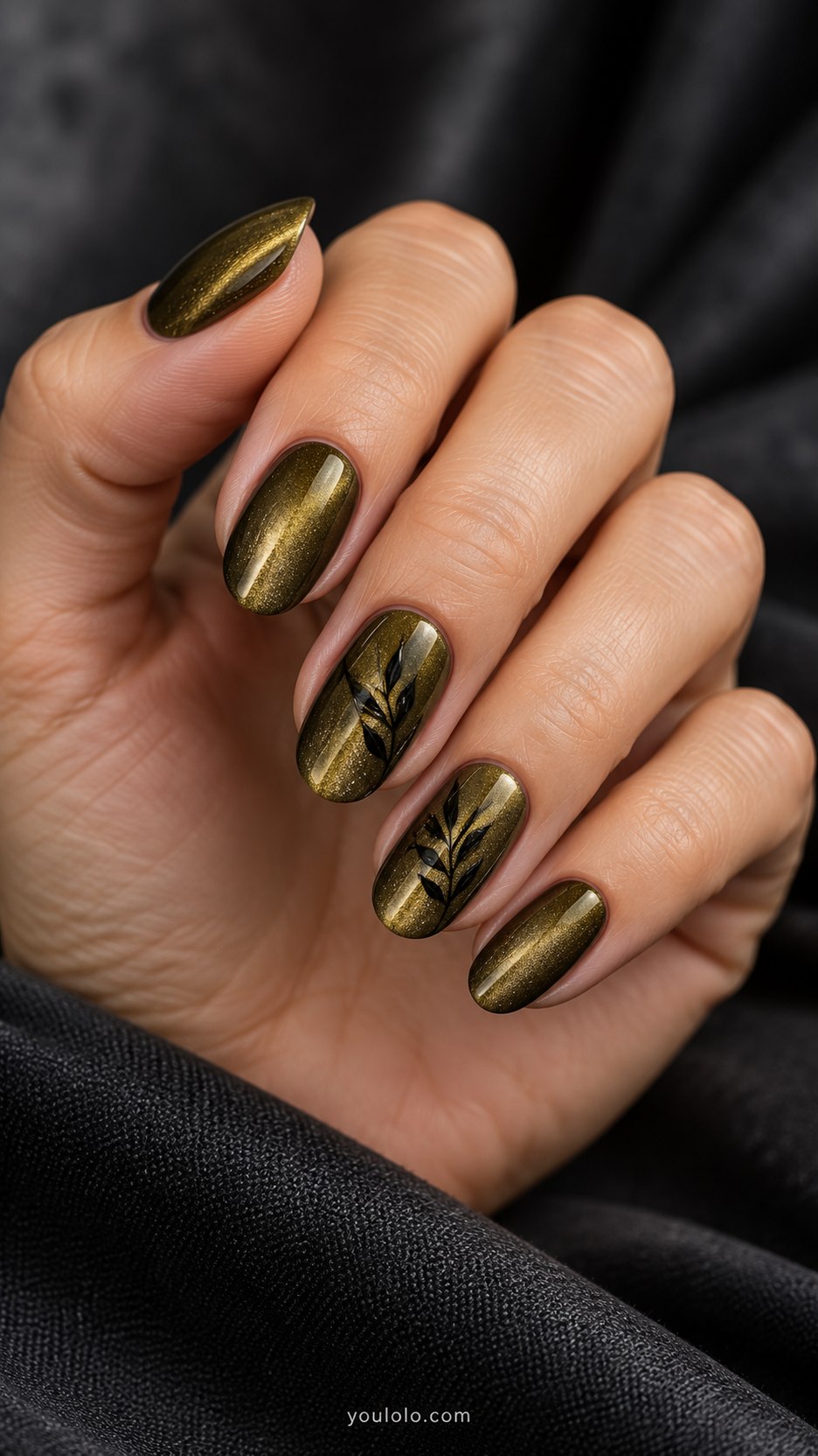 Olive-Gold Velvet Leaf Lines: medium oval olive gold magnetic velvet nails, one fine black botanical leaf outline on two accents