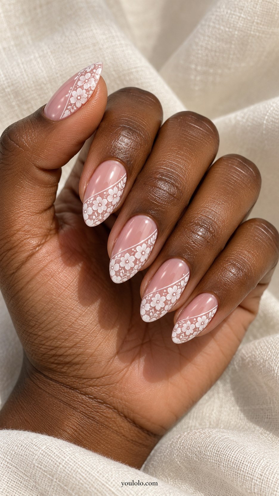 Asymmetric White Lace Panels: medium almond transparent pink nails, diagonal white floral lace panels covering half each nail