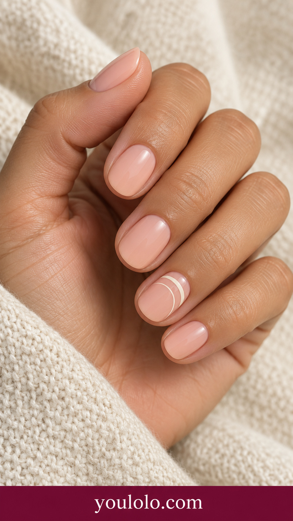 Peach Stacked Curves: short round pale peach nails two small cream nested semicircles on one side of ring nail on a naturally posed adult hand