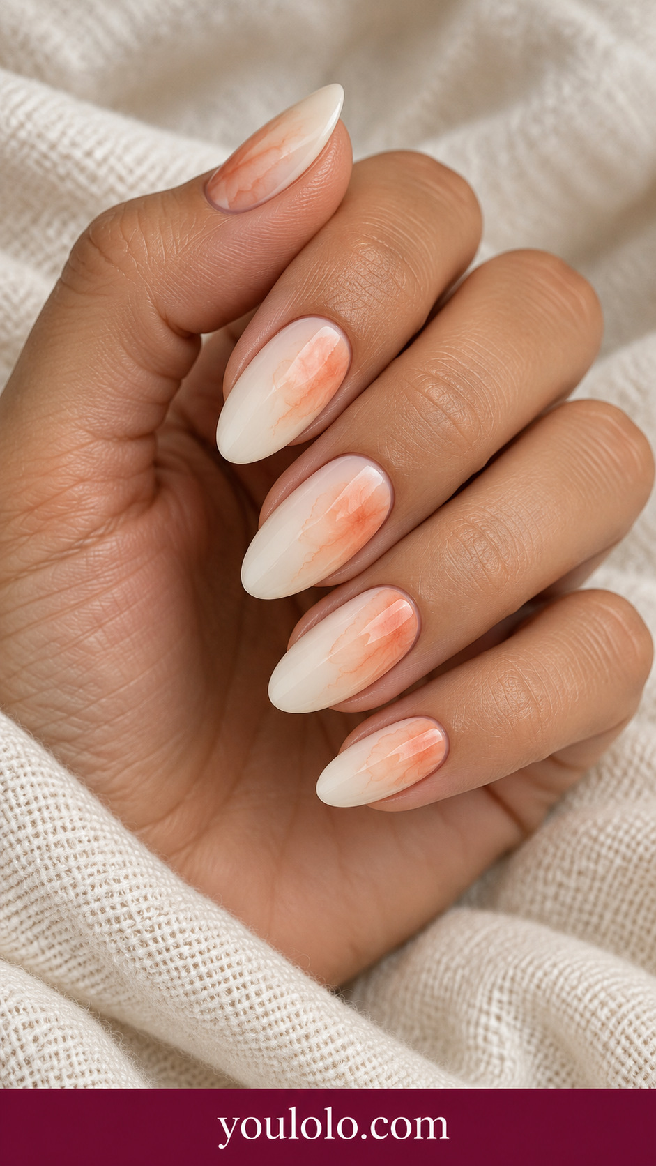 Apricot Cloud Fade: medium almond pale ivory nails one accent diffuse translucent apricot blooming cloud fading from one side on a naturally posed adult hand