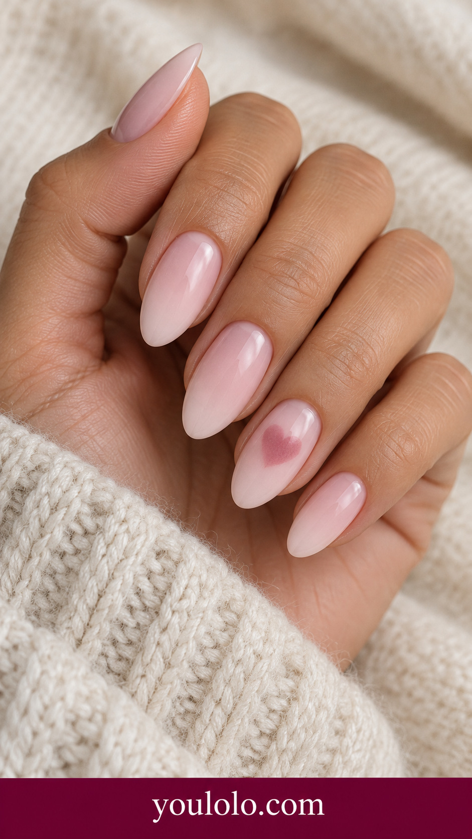 Rose Heart Halo: medium almond pale blush nails one accent softly diffused deeper rose heart silhouette centered, flat no gems on a naturally posed adult hand