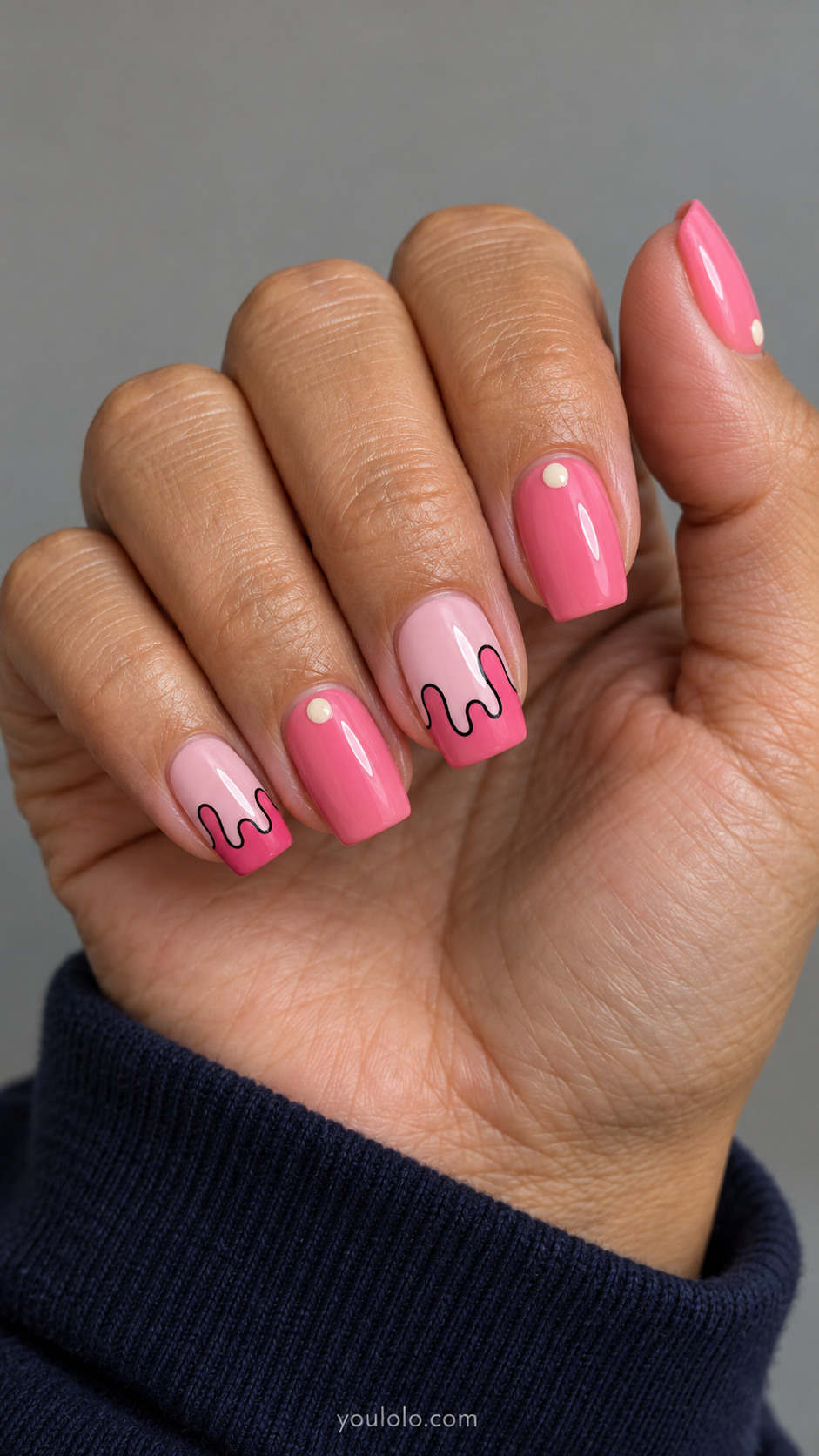 Square pale pink nails with hot pink drips outlined in black