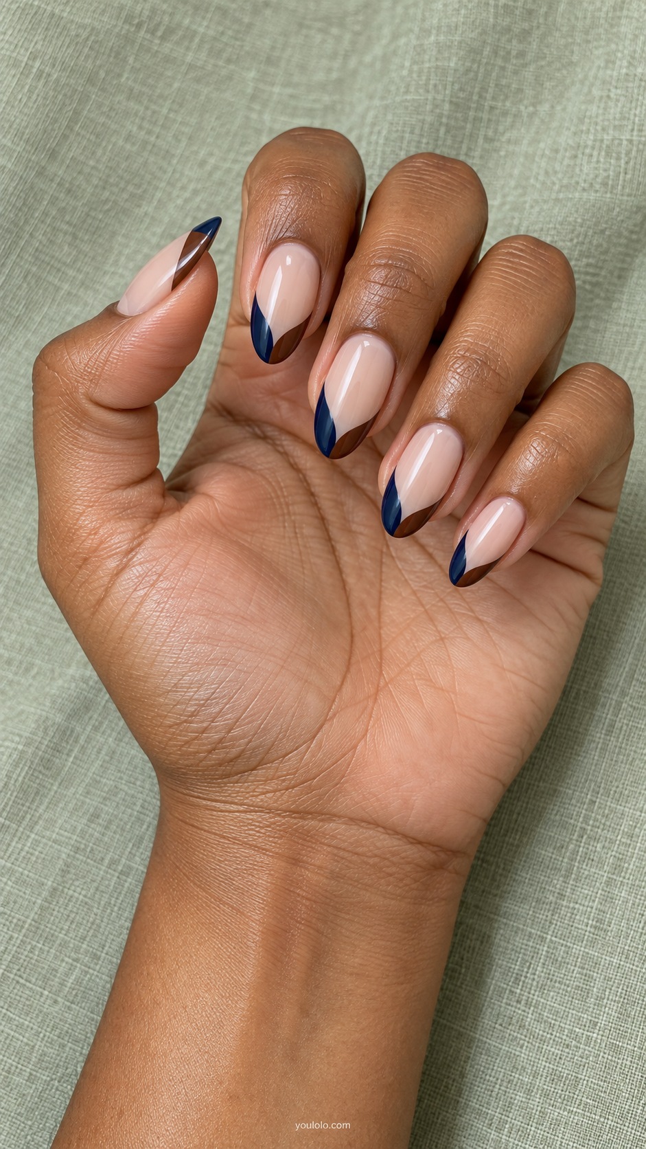 Brown Blue Asymmetric Tips — medium almond nude beige base French tips split into unequal navy blue and brown curved sections