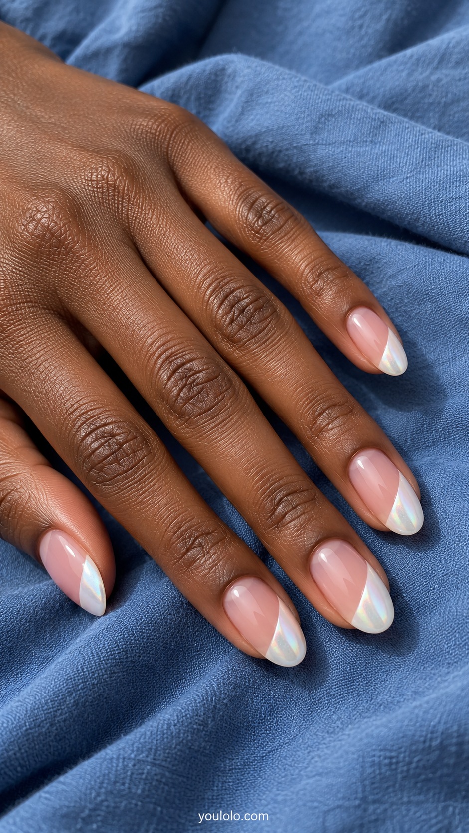 Medium oval nails transparent pink base, diagonal pearlescent white side French tips covering outer third each nail, clear boundary no other art