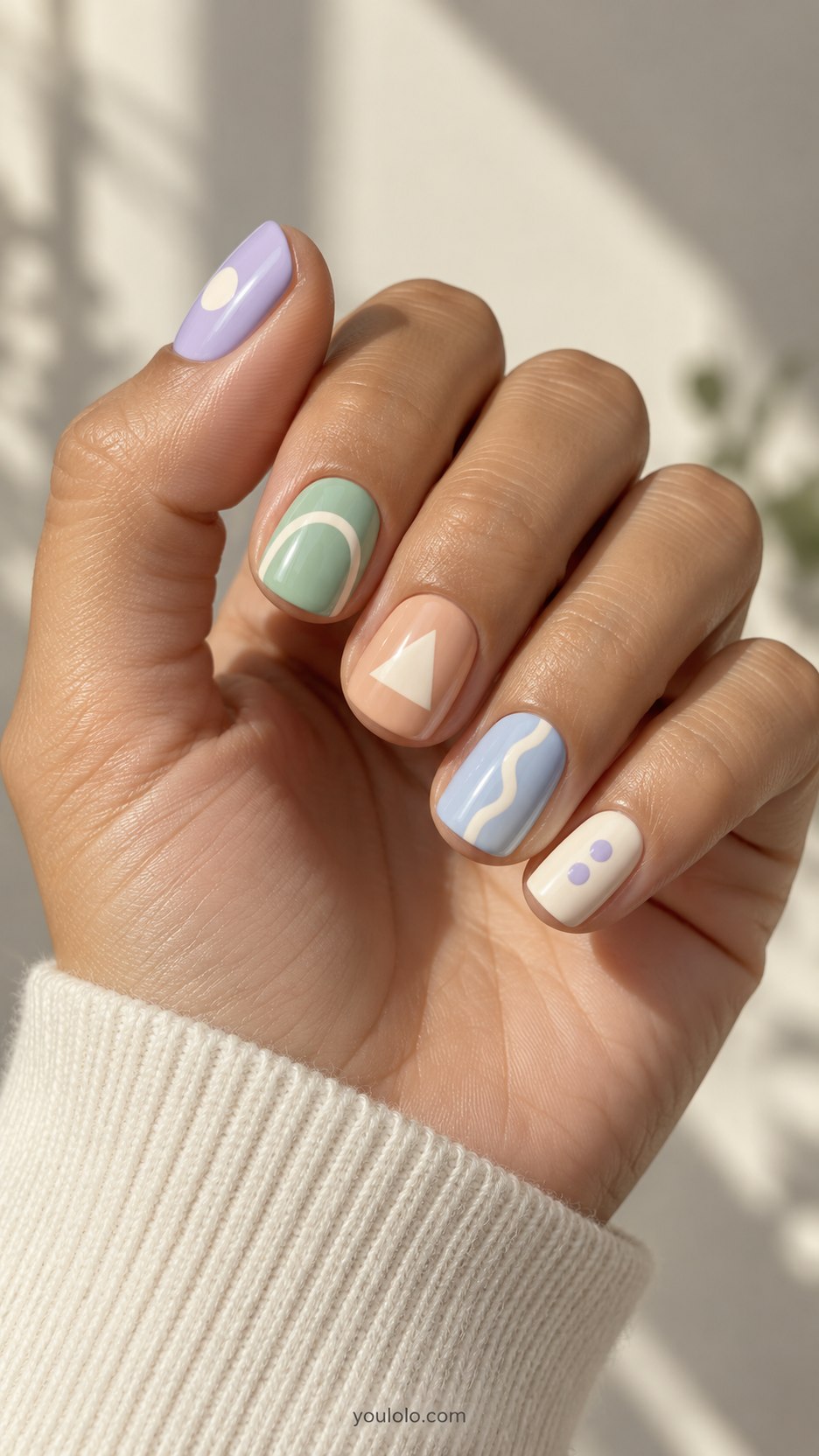 Pastel Shape Collection: short squoval lavender mint peach pale blue cream nails: circle, arch, triangle, wavy line, two tiny dots respectively