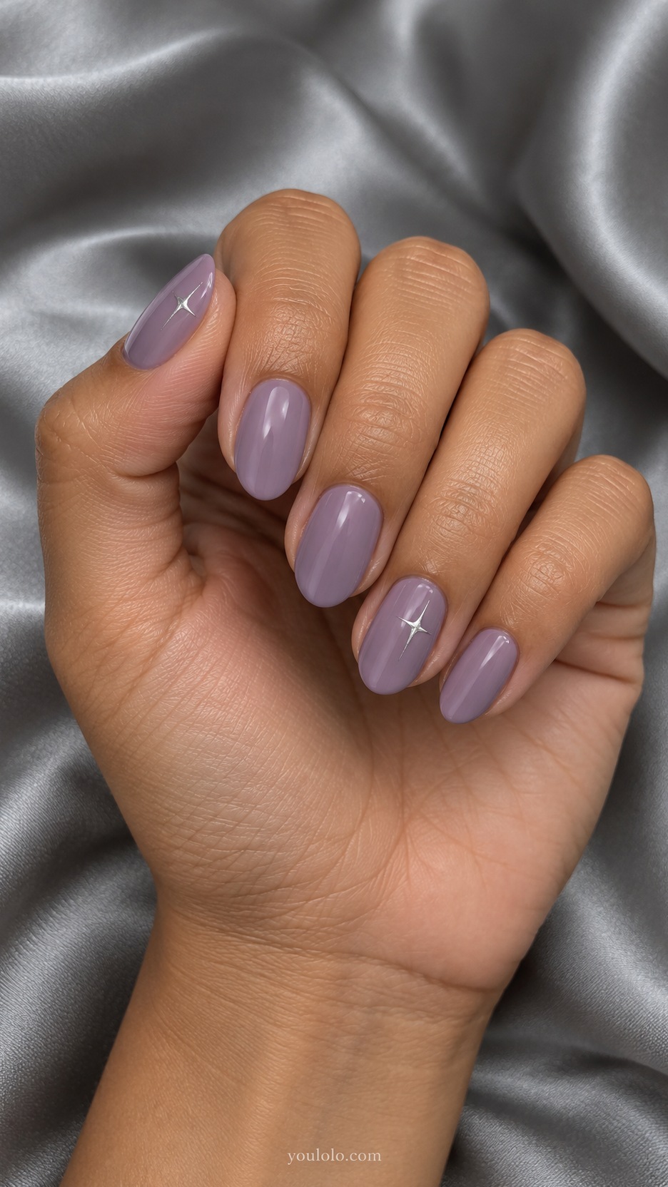 Short Almond Nail Designs: Lavender Tiny Stars manicure on a naturally posed hand