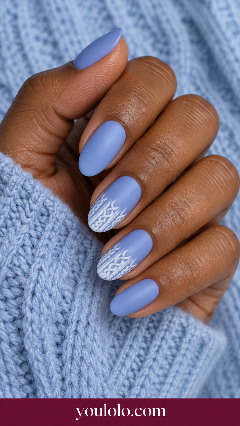 medium oval periwinkle nails two accents fine flat white cable knit drawing confined to bottom third, others plain periwinkle satin on a naturally relaxed adult hand