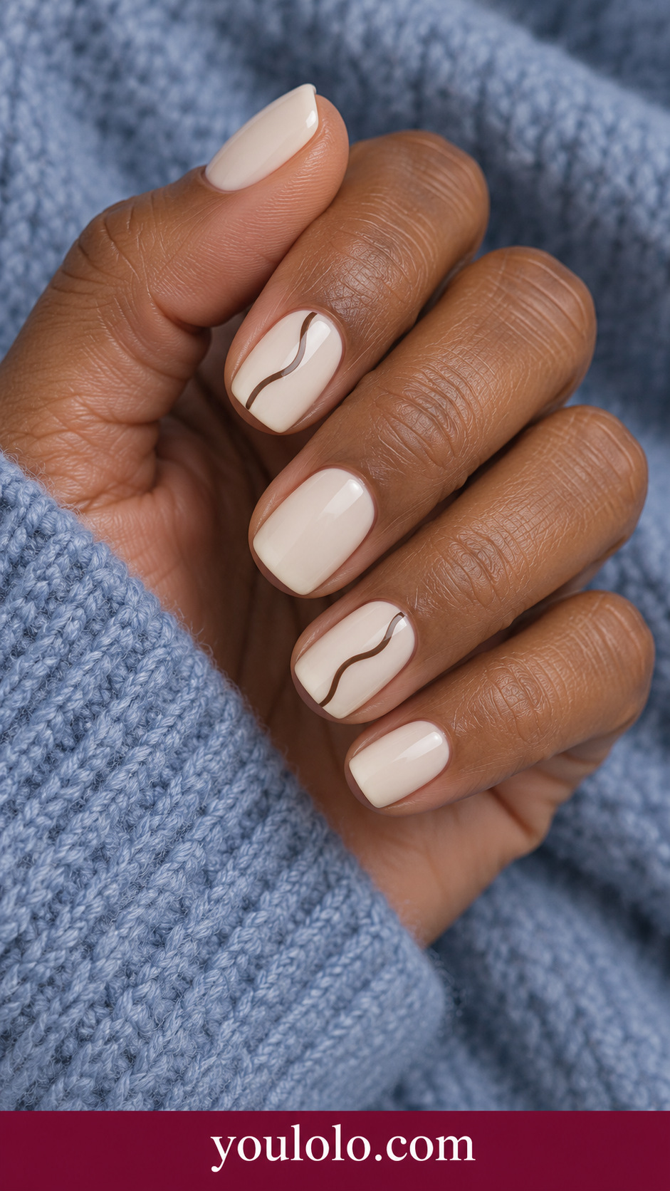 Chocolate Fine Squiggle: short soft square ivory nails one thin chocolate brown irregular S line on index and ring only on a naturally posed adult hand