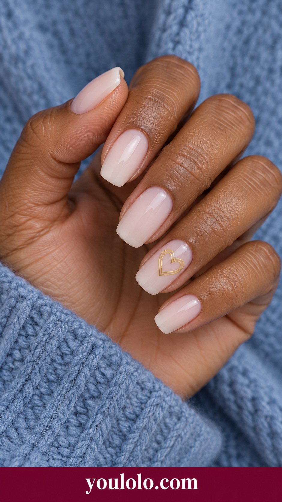 Gold Heart Double Line: medium soft square milky nude nails one small open gold heart outlined with two fine parallel strokes on ring nail on a naturally posed adult hand