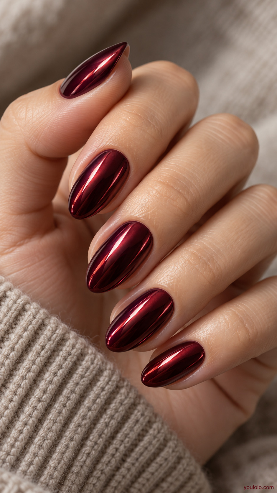 Burgundy Mirror Almonds on a naturally gathered feminine hand showing the nail finish
