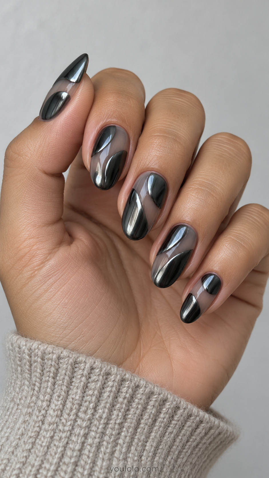 Medium almond translucent smoky taupe beds with broad flat dark gunmetal chrome organic patches per nail, thin smoky gaps, patches flush not raised